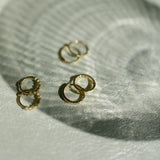 10k Solid Gold Channel CZ Huggie - - Earrings - Ofina