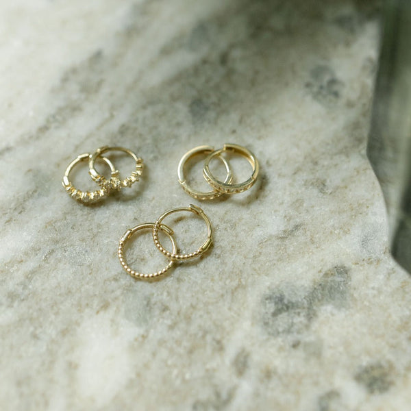 10k Solid Gold Channel CZ Huggie - - Earrings - Ofina