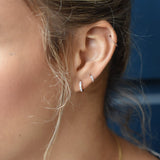10k Solid Gold Channel CZ Huggie - - Earrings - Ofina