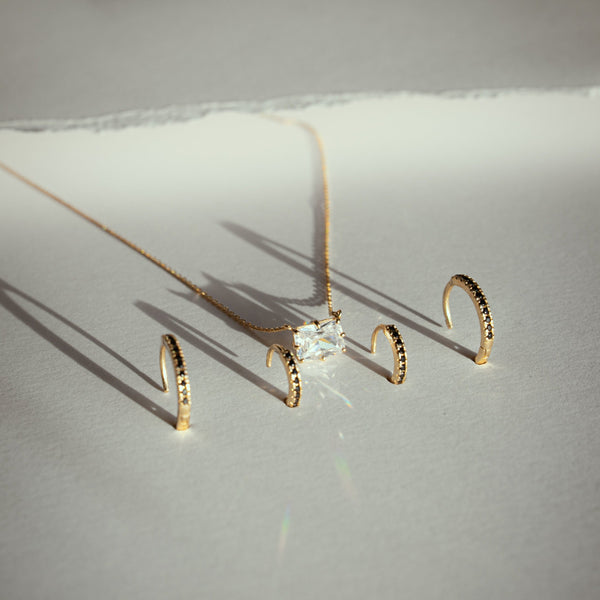 10k Solid Gold Black CZ Huggies - - Earrings - Ofina