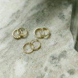 10k Solid Gold Prong CZ Huggie -  - Earrings - Ofina